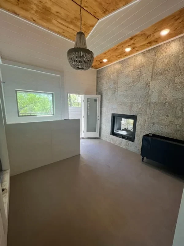 Interior room with new drywall, textured ceiling, recessed lighting, and window installation after water damage restoration